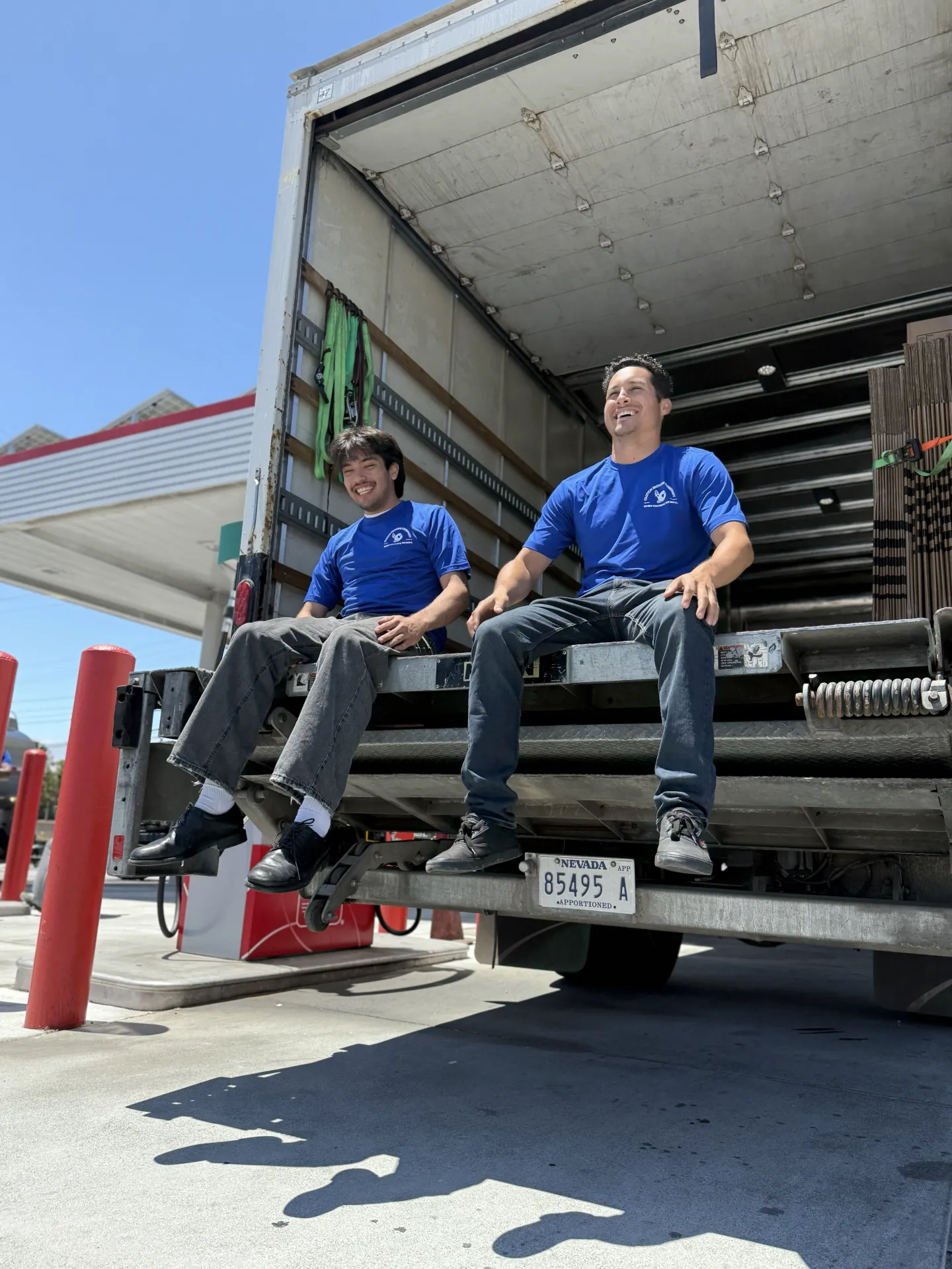 Two Clutch movers sitting on the moving truck liftgate